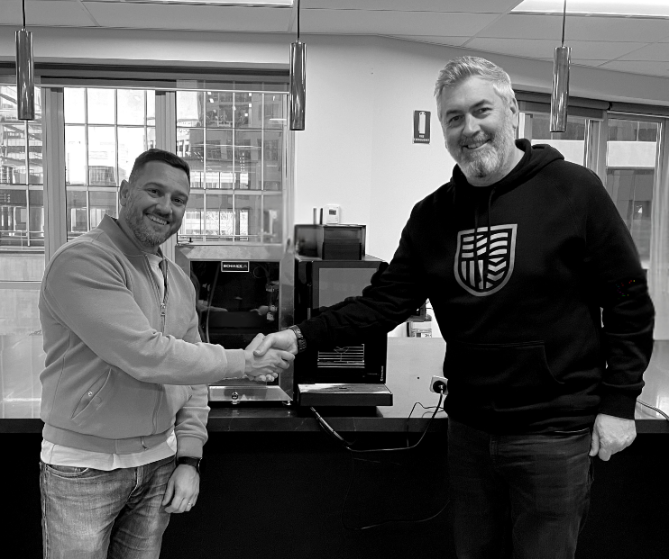 Andrew Knight and Claudio Da Rocha shaking hands